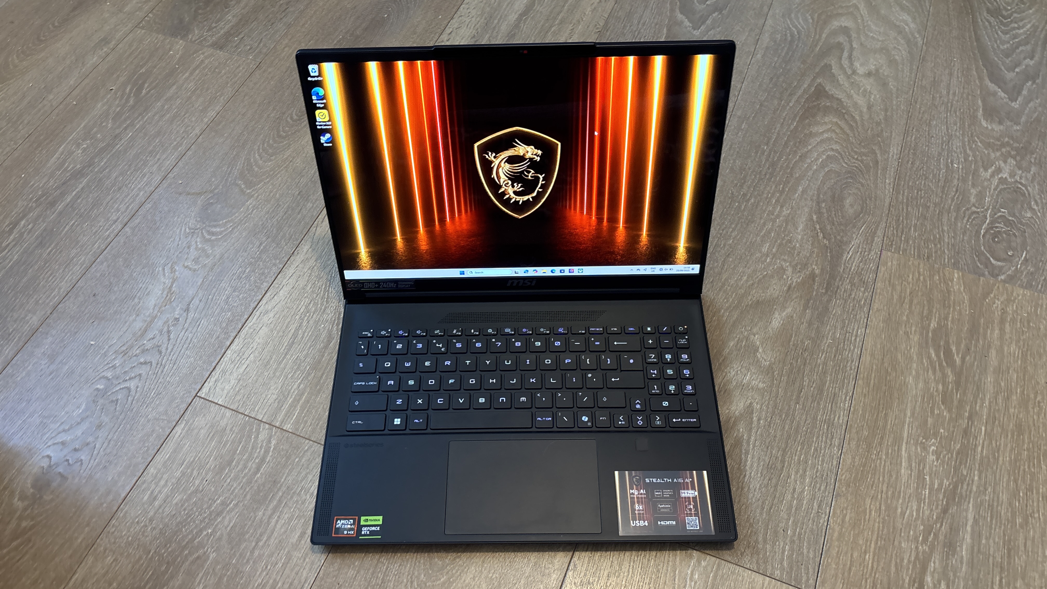 MSI Stealth A16 AI+ on wooden surface