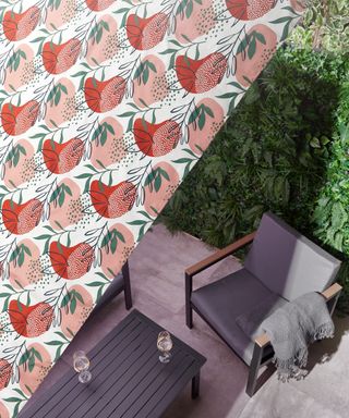 A patterned shade sail covering an outdoor armchair