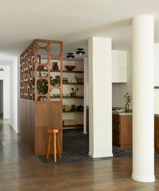 kitchen with open shelving, pillars and cut out screens