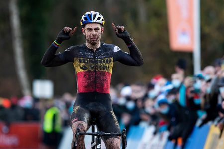 Belgian Wout Van Aert celebrates as he crosses the finish line to win the mens elite race of the 56th edition of the Robotland Cyclocross Essen in the Ethias Cross cyclocross competition Saturday 11 December 2021 in Essen BELGA PHOTO KRISTOF VAN ACCOM Photo by KRISTOF VAN ACCOMBELGA MAGAFP via Getty Images