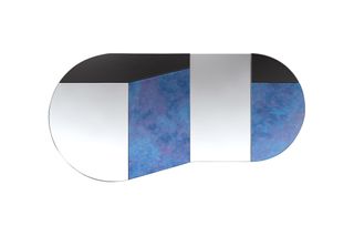 An asymmetric mirror with blue and black sections