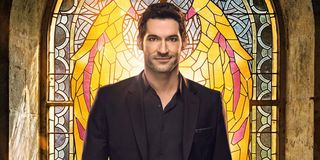 Lucifer poster Tom Ellis stands in front of stained glass window