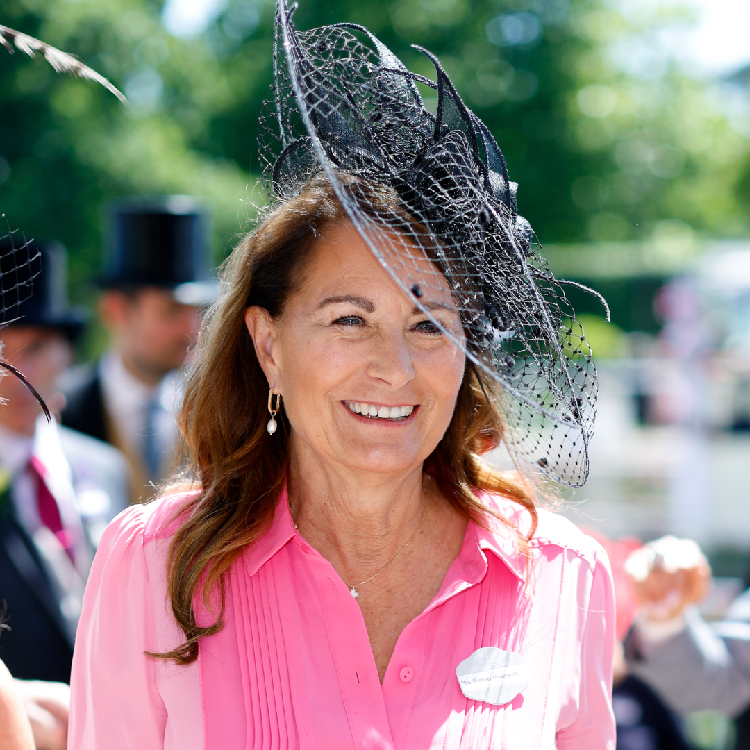 Princess Kate's mom Carole Middleton wears a bright pink dress with a black hat
