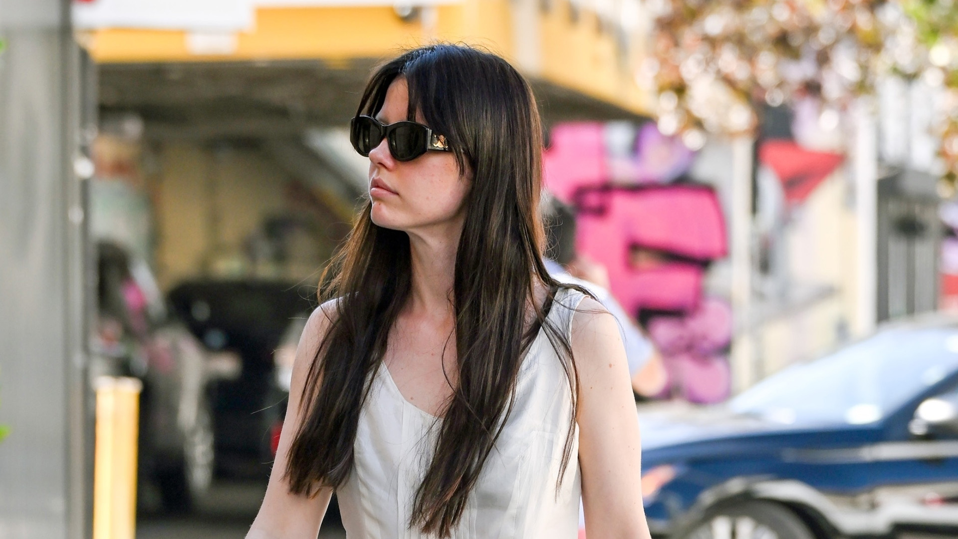 Mia Goth in flip flops