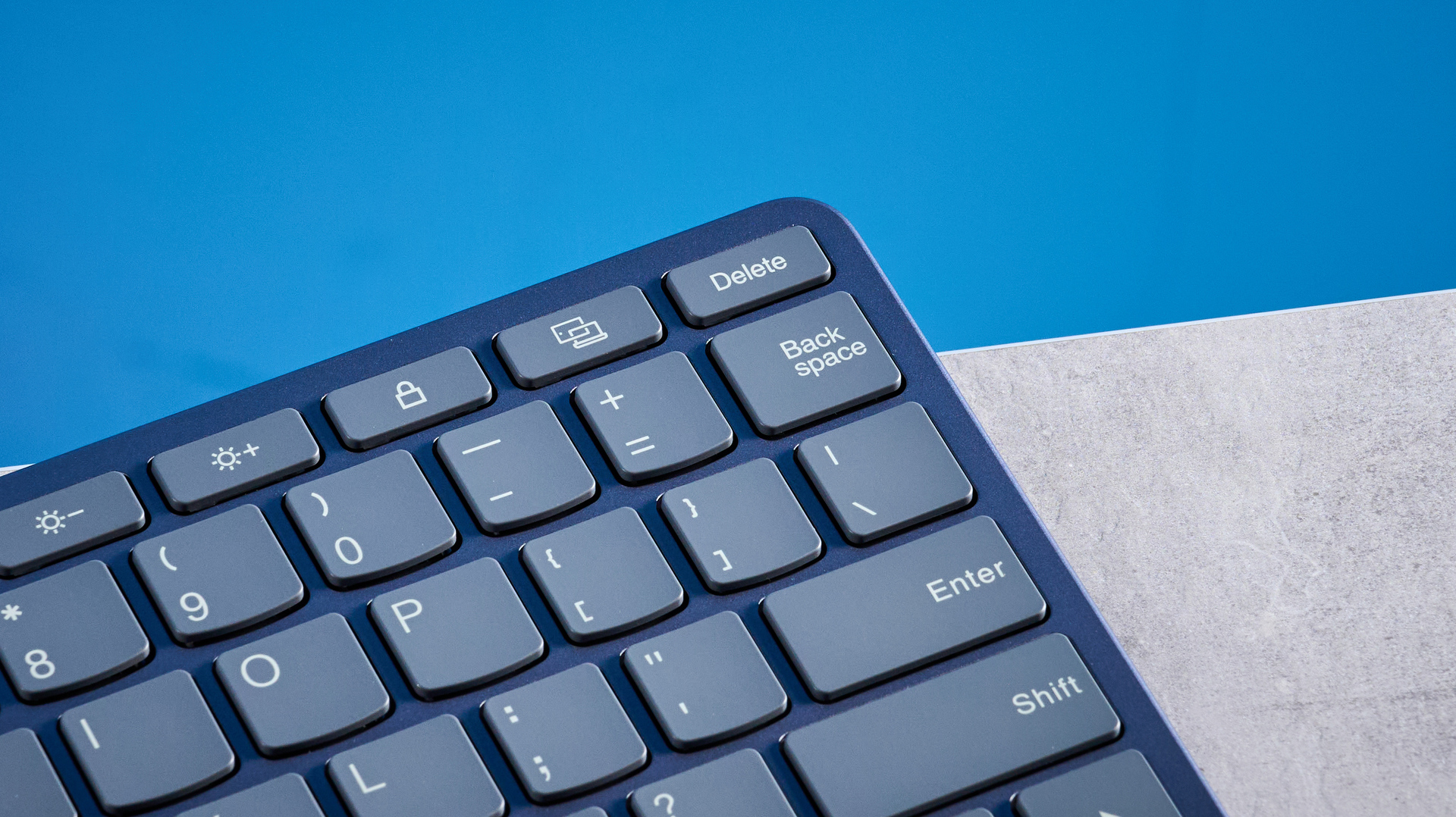 Lenovo Multi Device Keyboard photographed in front of a blue background.