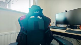 A black Boulies Ninja Pro chair in a small office