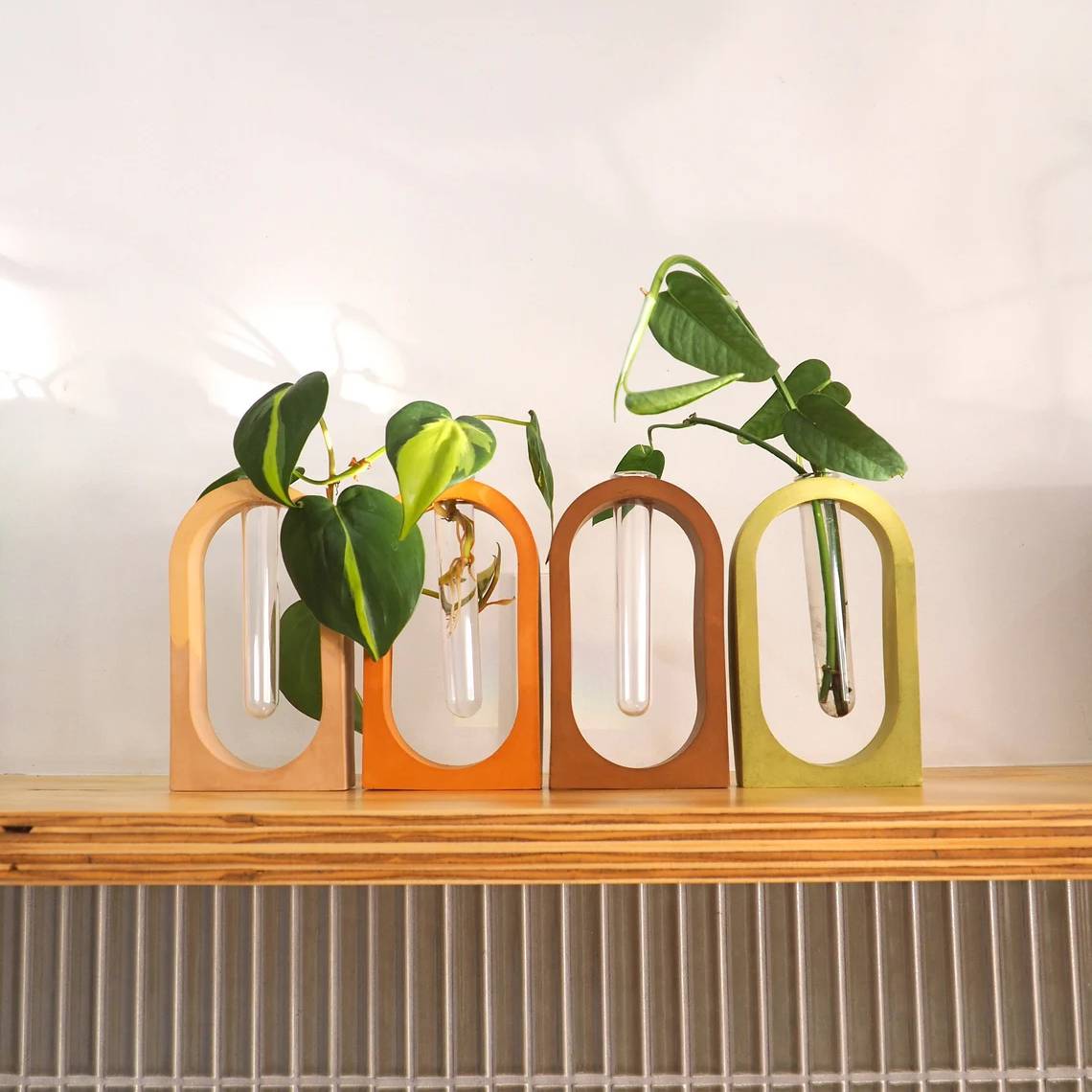 Earth-toned arches holding propagation tubes