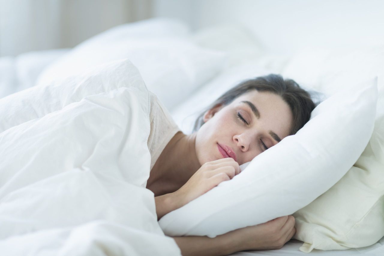 woman asleep on pillow