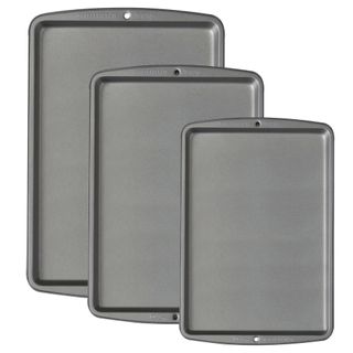 Set of three silver metal oven trays