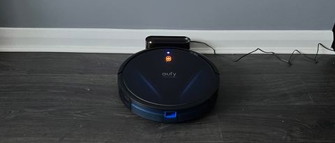 The Eufy RoboVac G20 charging on its base station