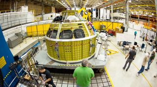 Workers at the Michoud Assembly Facility complete the Orion pressure vessel