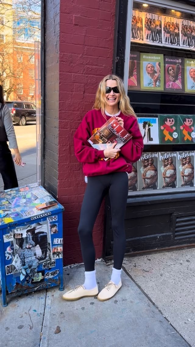 courtney wears leggings with white slim sneakers.