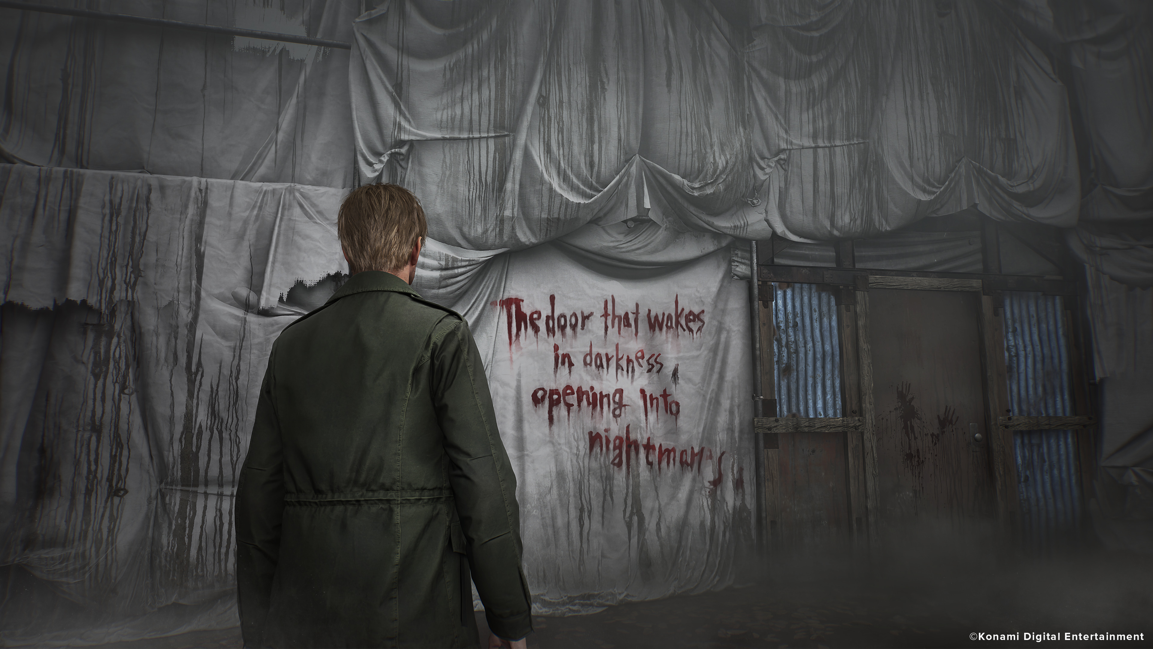 James looks at graffiti reading "The door that wakes in darkness opening into nightmares."
