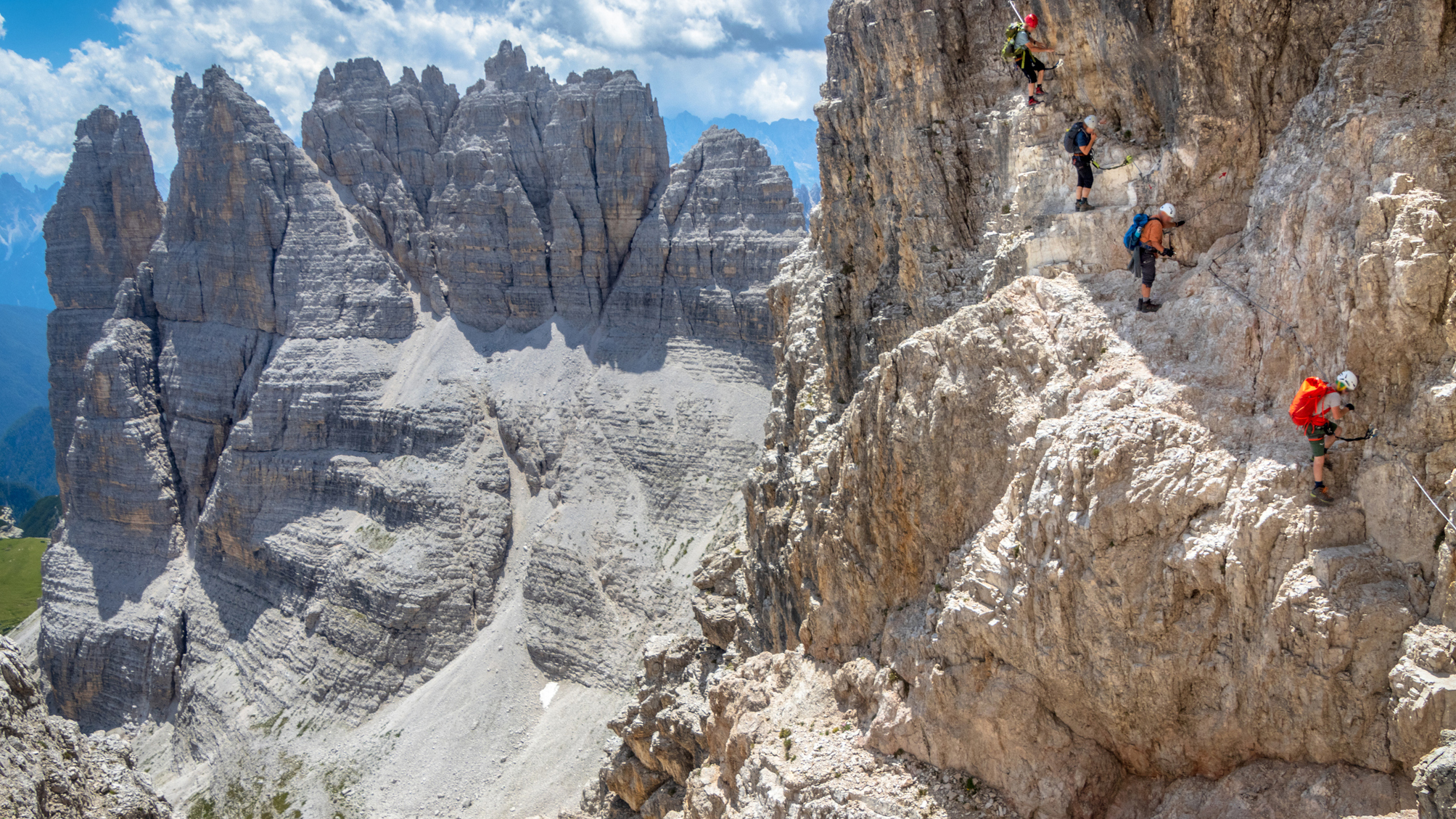 Five climbers on a via Ferrata route in the Italian Dolomites