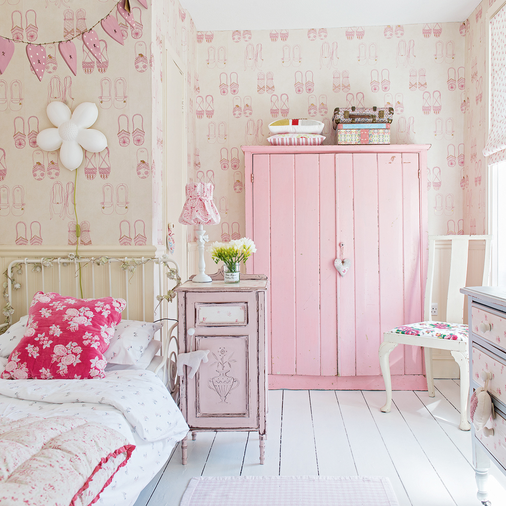 girls bedroom with wallpaper and wardrobe