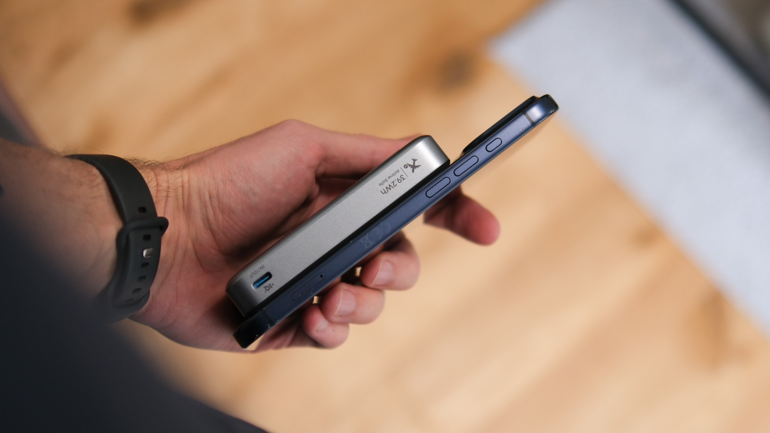 Side profile of the Anker MagGo Power Bank 2 Pro attached magnetically to a smartphone, showing the battery pack&amp;rsquo;s thickness and USB-C port.