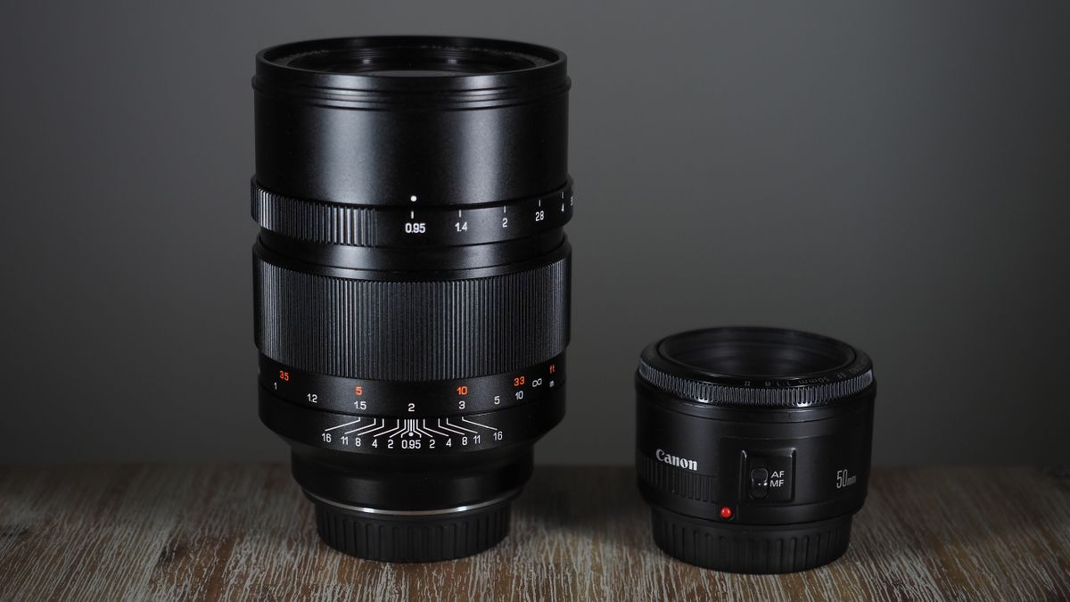 Zhongyi Mitakon Speedmaster 50mm f/0.95 on a wooden surface next to the Canon RF 50mm f/1.8 STM