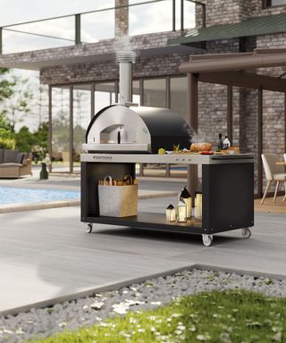large pizza oven and stand on a patio