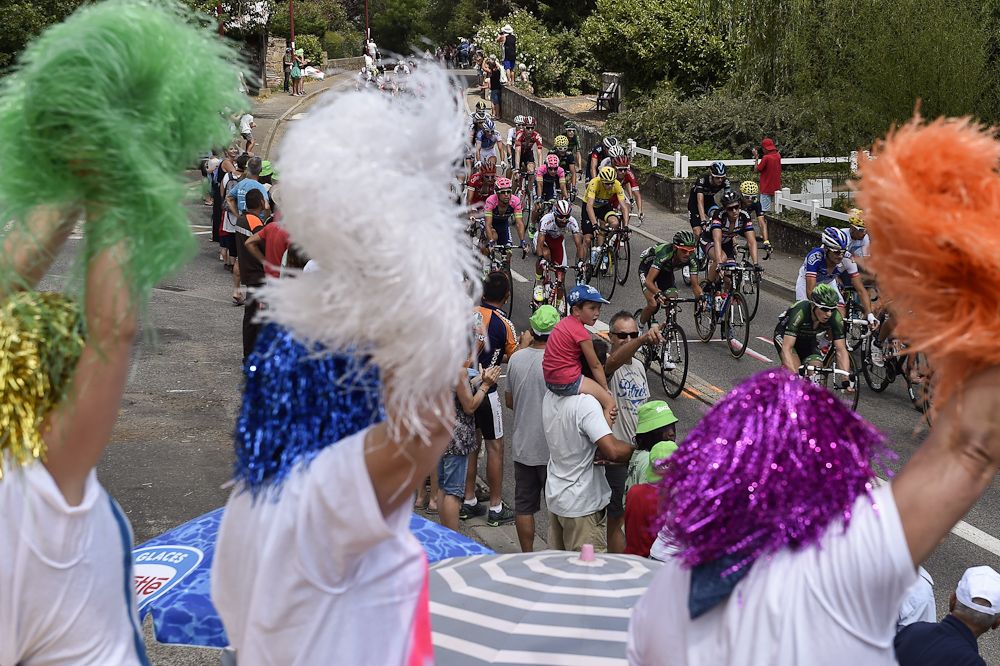 Spectators enjoy the action during stage 14.