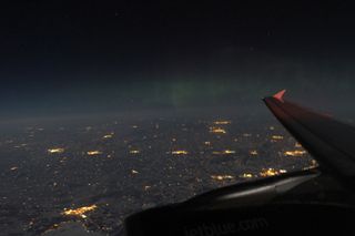 Aurora Viewed Through an Airplane Window