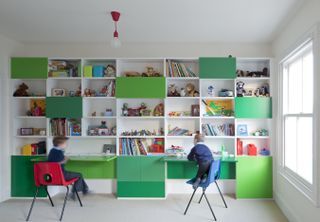 Playroom with storage cupboards by Paul Archer Design