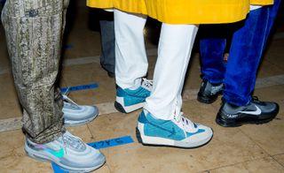 Models wear sneakers at Off-White S/S 2019