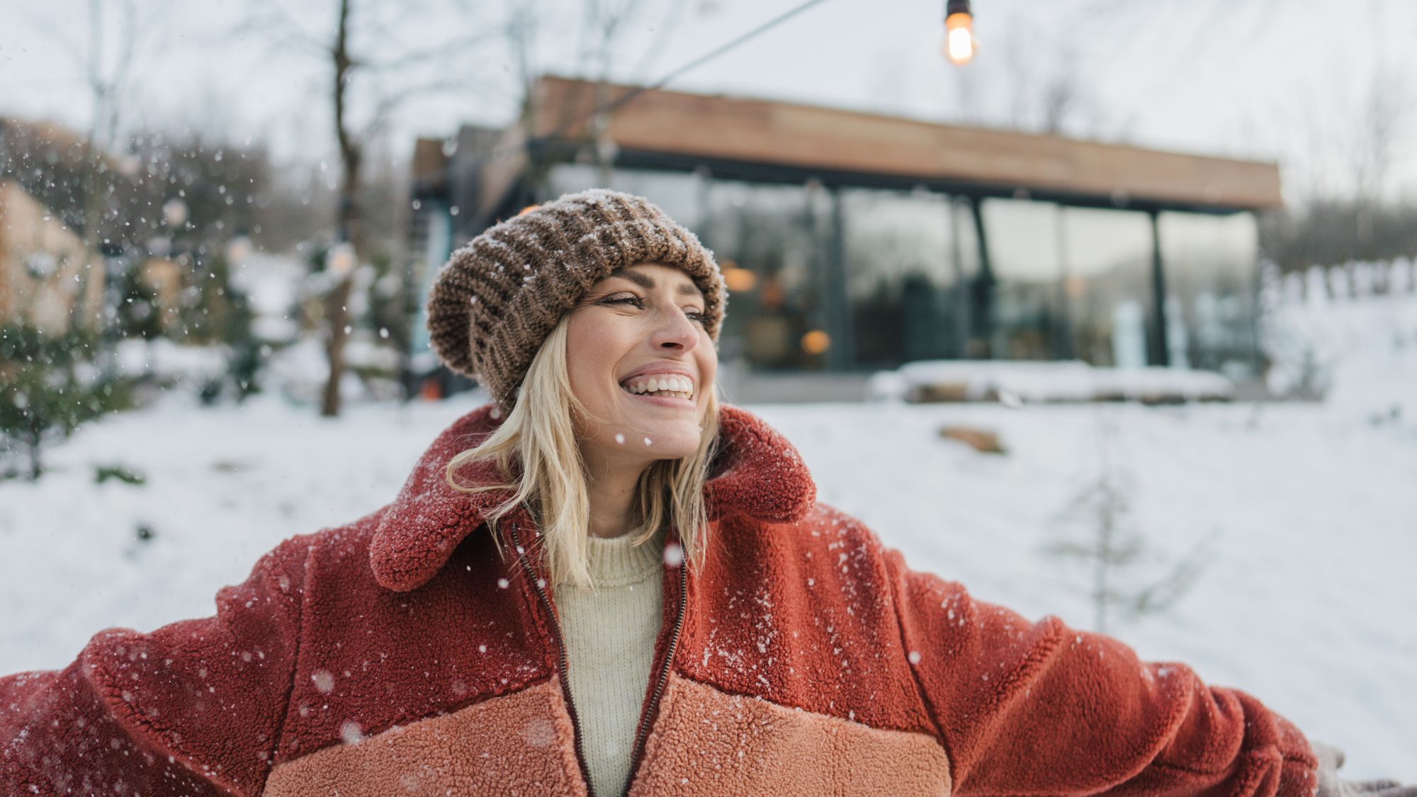 Winter reset: A woman outside in the snow, enjoying fresh air