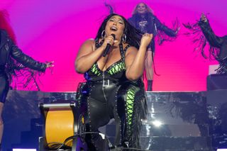 Lizzo performing on stage.