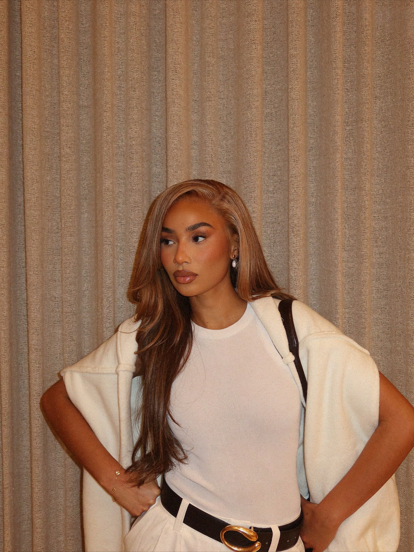 Symphani Soto with brown hair with blonde highlights