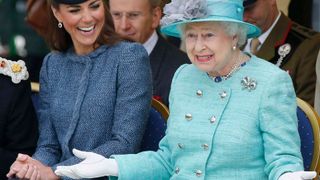 Kate Middleton laughing with Queen Elizabeth II