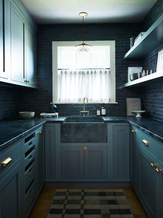 a small dark blue butler's pantry