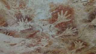 Human hand stencils, discovered in caves hidden in a remote mountainous area on the Sangkulirang-Mangkalihat Peninsula are seen in East Kalimantan, Indonesia on November 08, 2018 in Kalimantan.