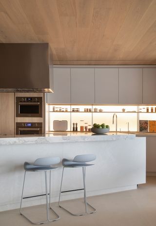 A kitchen with backlit cabinets