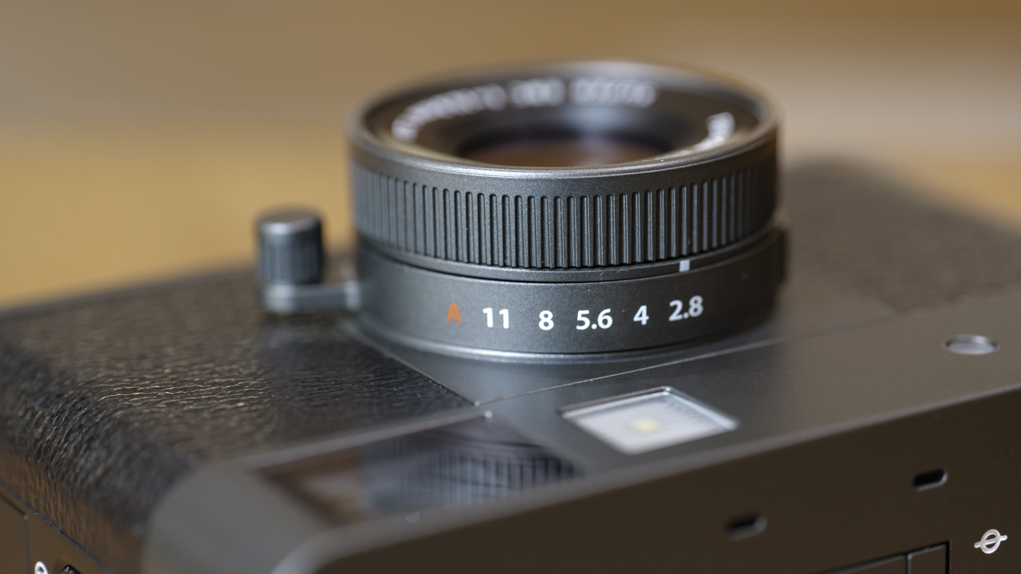 Close up of Fujifilm X half compact camera's lens aperture ring