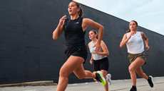 3 women running in Under Armour apparel.