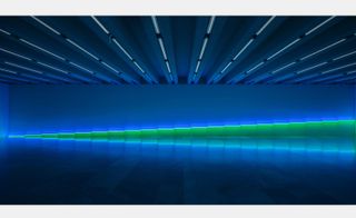 blue and green neon light sculpture by Dan Flavin in gallery