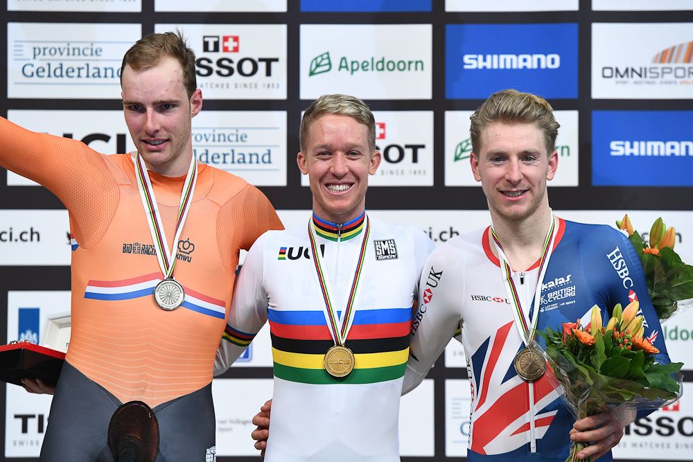 Sliver medalist Netherland's Jan Willem Van Schip, Gold medalist Australian Cameron Meyer and Bronze medalist Britton Mark Stweart pose on the podium after the men's points race final