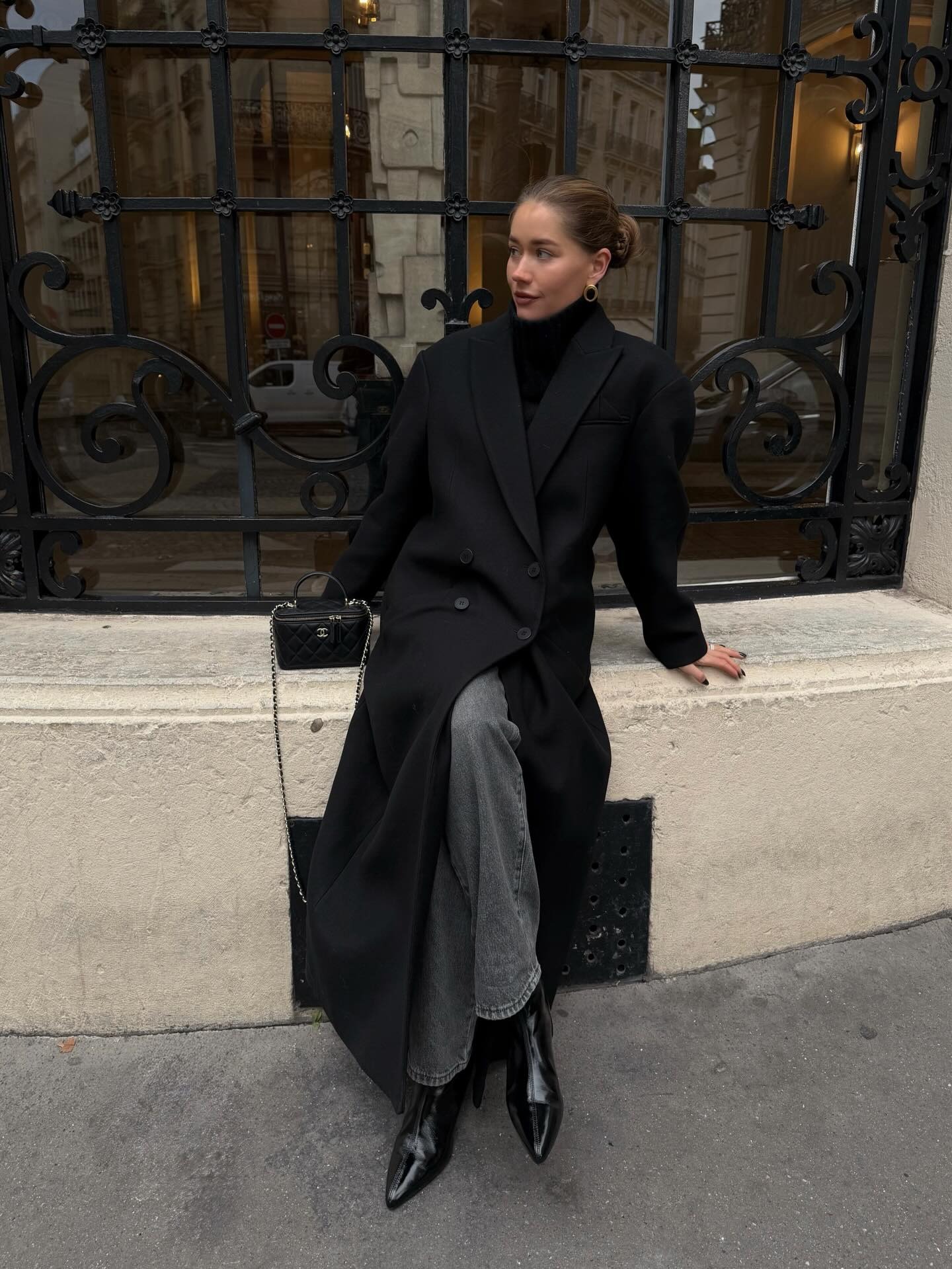 Woman wearing double-breasted coat.