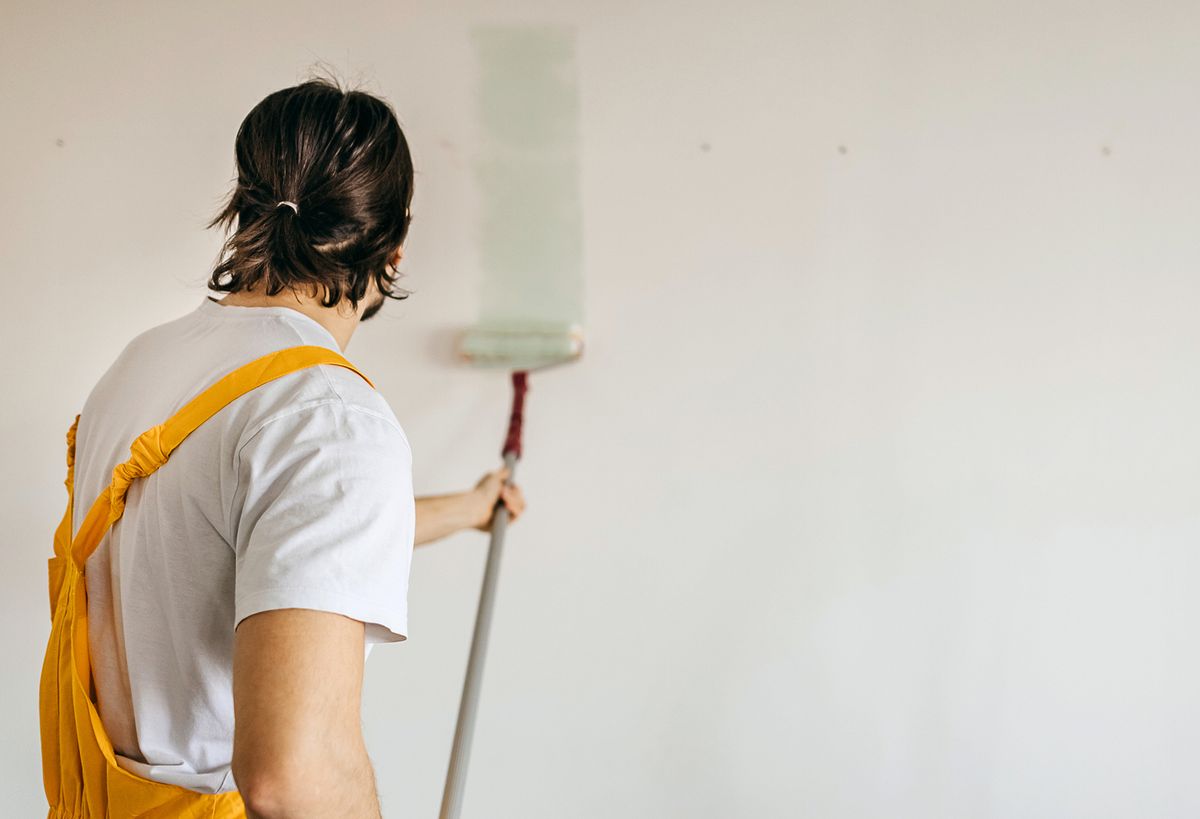 a man painting a wall