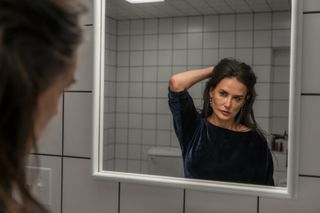 Demi Moore as elisabeth sparkle looking in the mirror in 'The Substance'