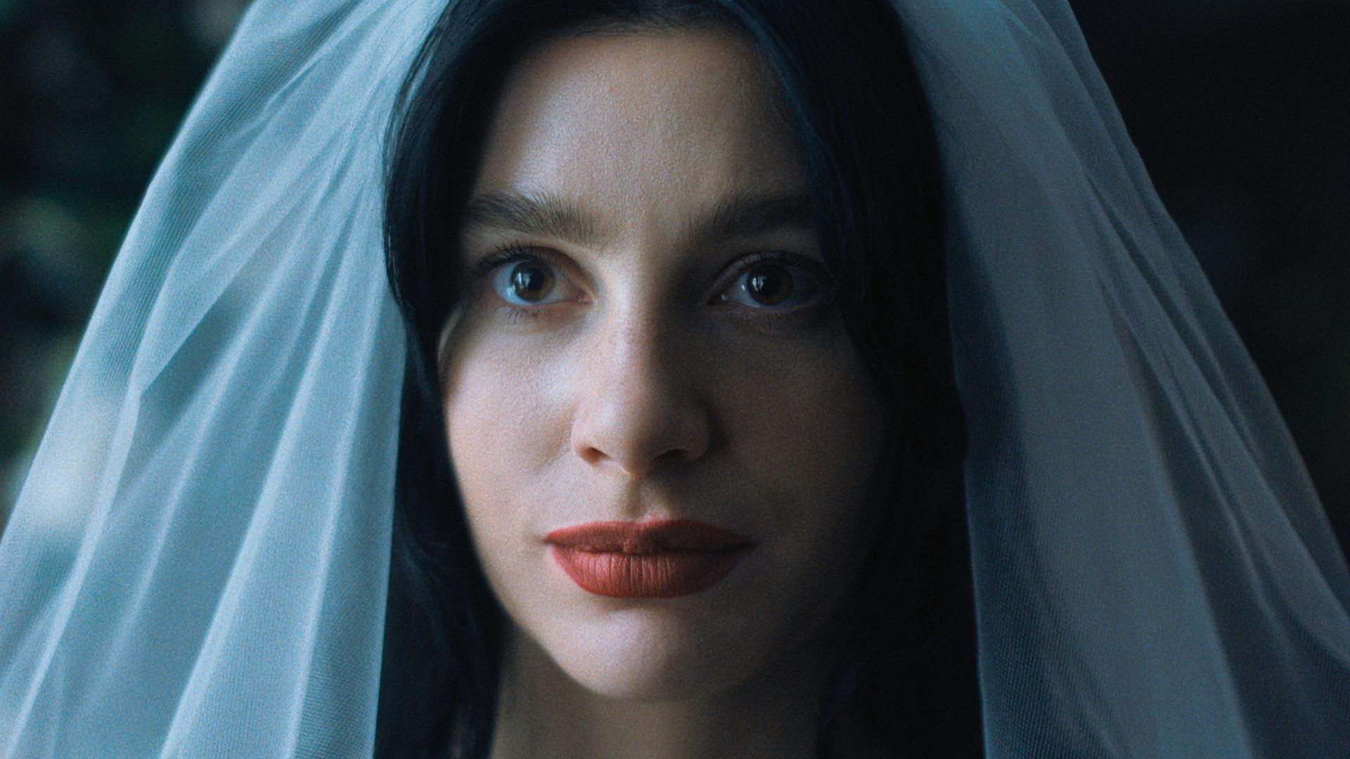 Camile Morrone wears a bridal veil