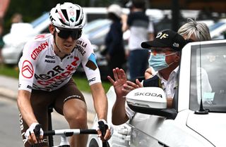 Ben O'Connor speaks with race medics during stage 9 at the Tour de France