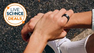 The Samsung Galaxy Ring on a persons hand with Live Science deals logo overlay