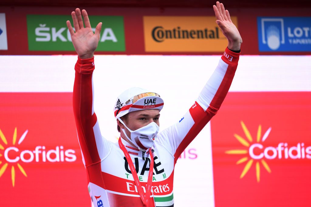 PUEBLA DE SANABRIA SPAIN NOVEMBER 05 Podium Jasper Philipsen of Belgium and UAE Team Emirates Celebration Trophy during the 75th Tour of Spain 2020 Stage 15 a 2308km stage from Mos to Puebla de Sanabria 924m lavuelta LaVuelta20 La Vuelta on November 05 2020 in Puebla de Sanabria Spain Photo by David RamosGetty Images