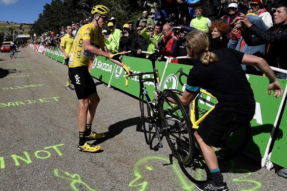 Chris Froome gets a new bike from his team on Mont Ventoux