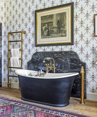 Traditional bathroom with marble wall and freestanding tub