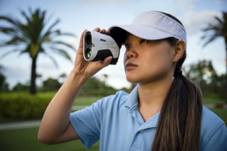 Nikon Coolshot laser pictured being used by a golfer