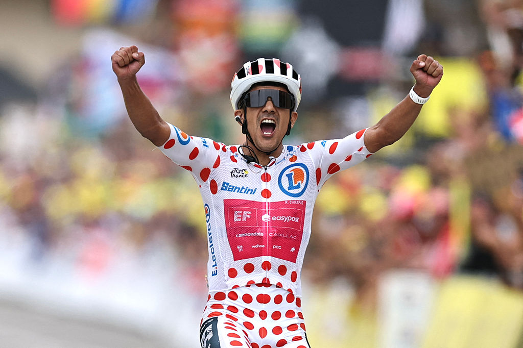EF Education - EasyPost team's Ecuadorian rider Richard Carapaz wearing the climber's dotted "King of the Mountains" jersey cycles to the finish line to win the 20th stage of the 113th edition of the Tour de France cycling race, 170,9 km between Le Bourg-d'Oisans and Alpe d'Huez in the French Alps, on July 25, 2026. (Photo by Anne-Christine POUJOULAT / AFP via Getty Images)