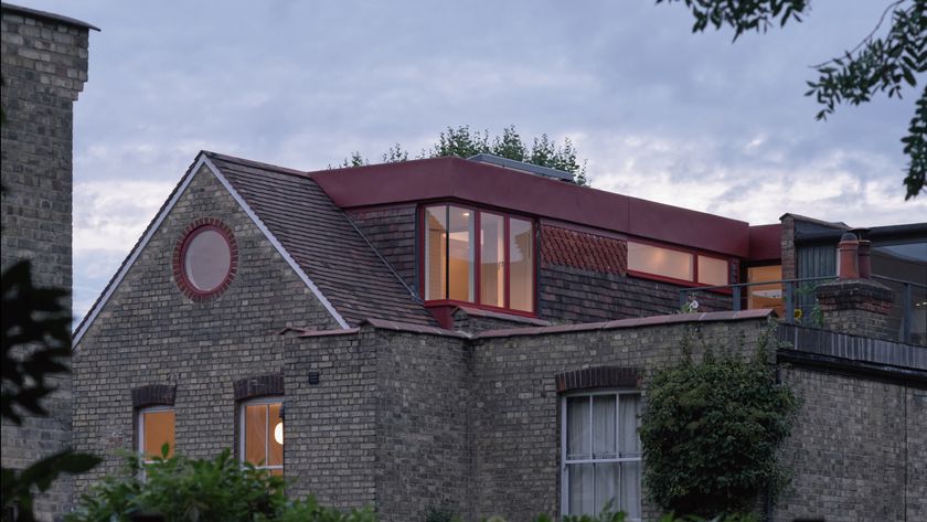 dormer loft conversion with red cladding on rear of house
