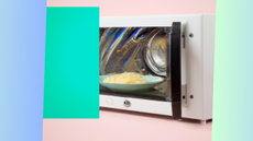 Microwave with plate inside on abstract background